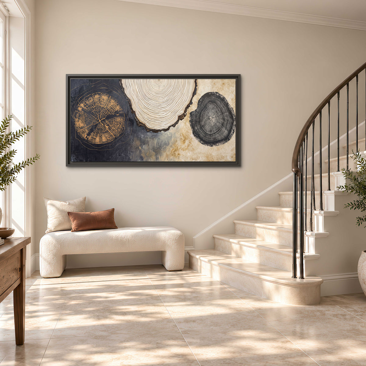 Circular tree-ring motifs in charcoal, cream and gold tones single framed canvas wall art styled in an interior