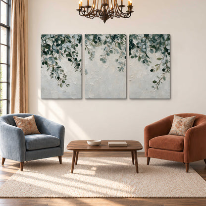 Soft green eucalyptus branches on a cream background 3 piece canvas wall art styled in an interior