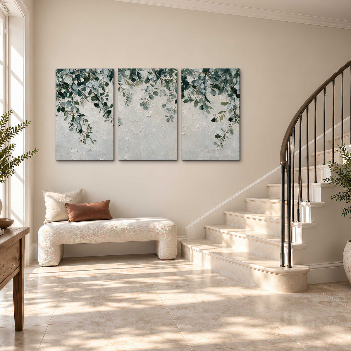 Soft green eucalyptus branches on a cream background 3 piece canvas wall art styled in an interior