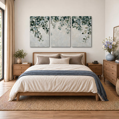 Soft green eucalyptus branches on a cream background 3 piece canvas wall art styled in an interior