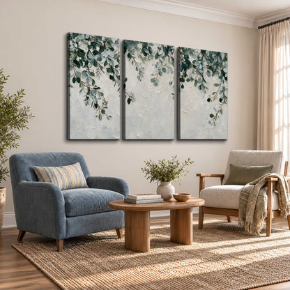Soft green eucalyptus branches on a cream background 3 piece canvas wall art styled in an interior