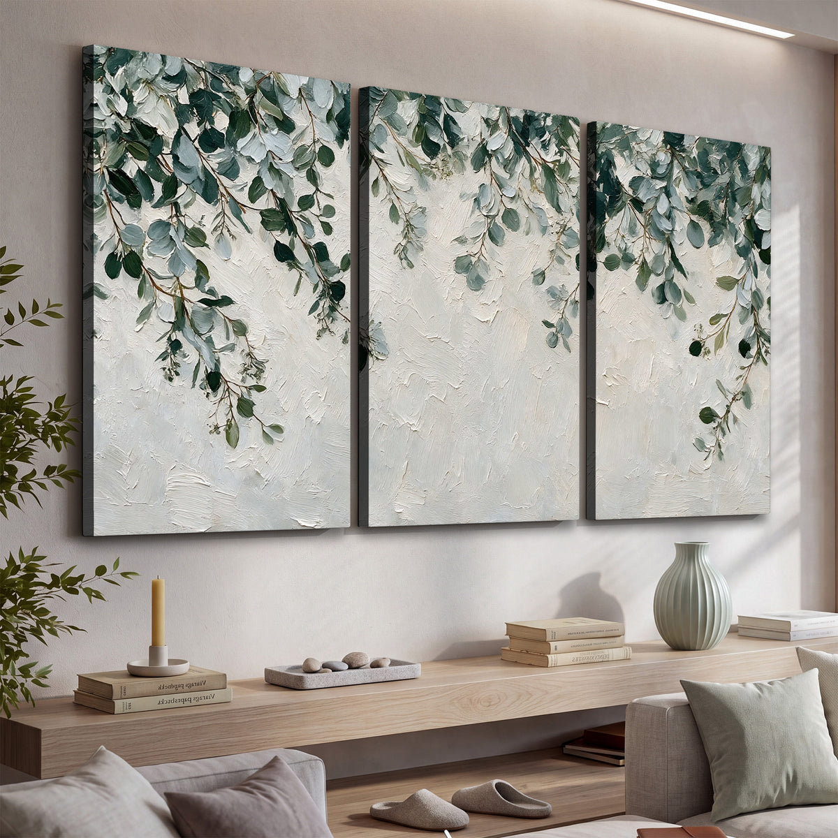 Soft green eucalyptus branches on a cream background 3 piece canvas wall art displayed in a console