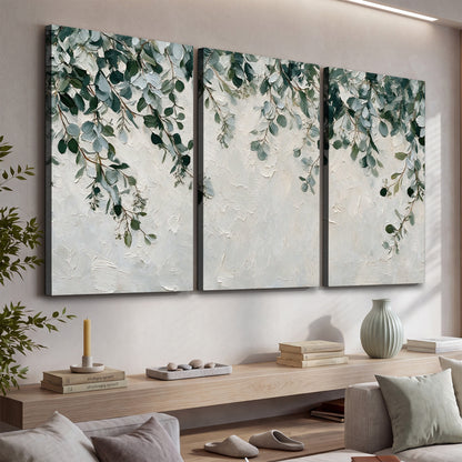 Soft green eucalyptus branches on a cream background 3 piece canvas wall art displayed in a console
