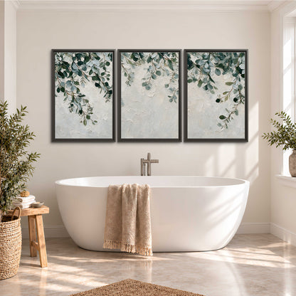 Soft green eucalyptus branches on a cream background 3 piece framed canvas wall art styled in an interior