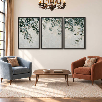 Soft green eucalyptus branches on a cream background 3 piece framed canvas wall art styled in an interior