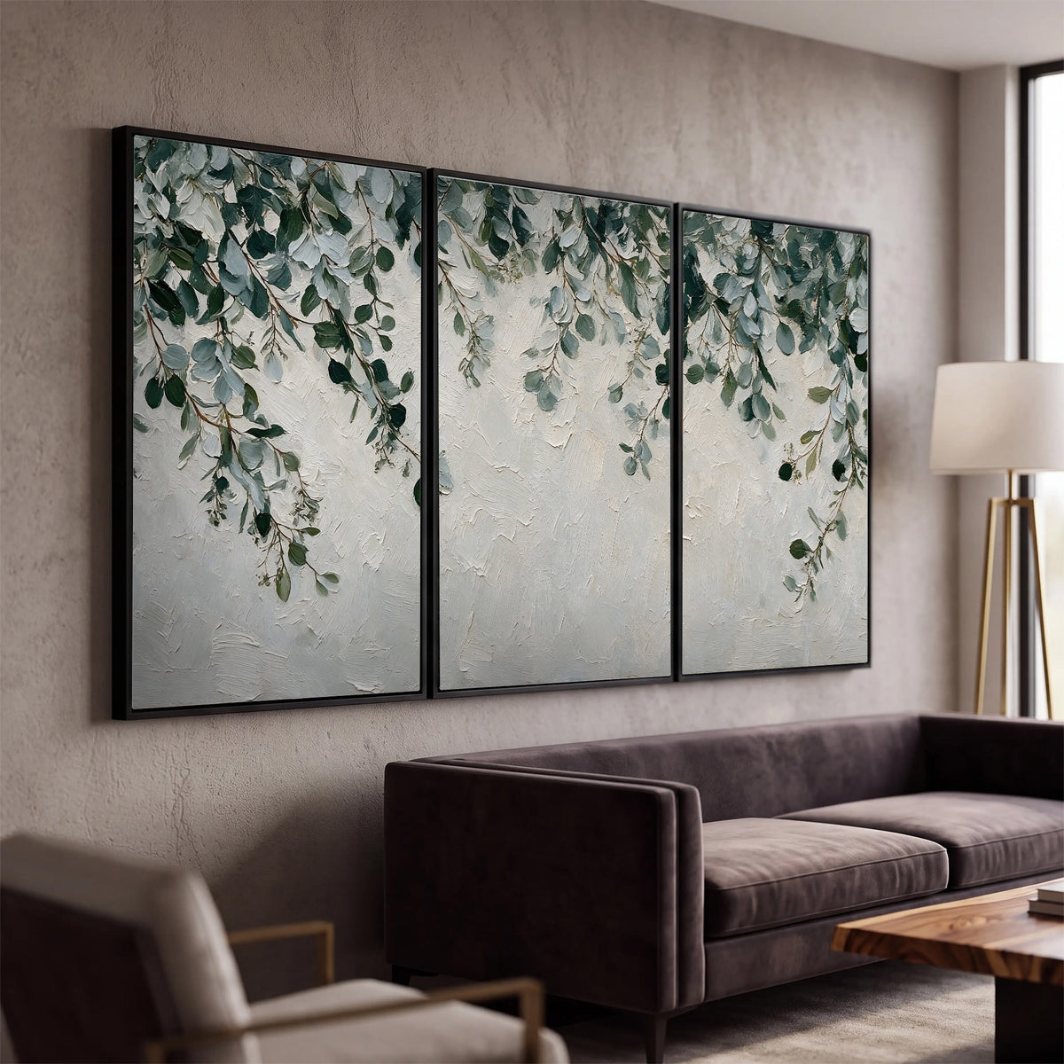 Soft green eucalyptus branches on a cream background 3 piece framed canvas wall art displayed in a modern living room