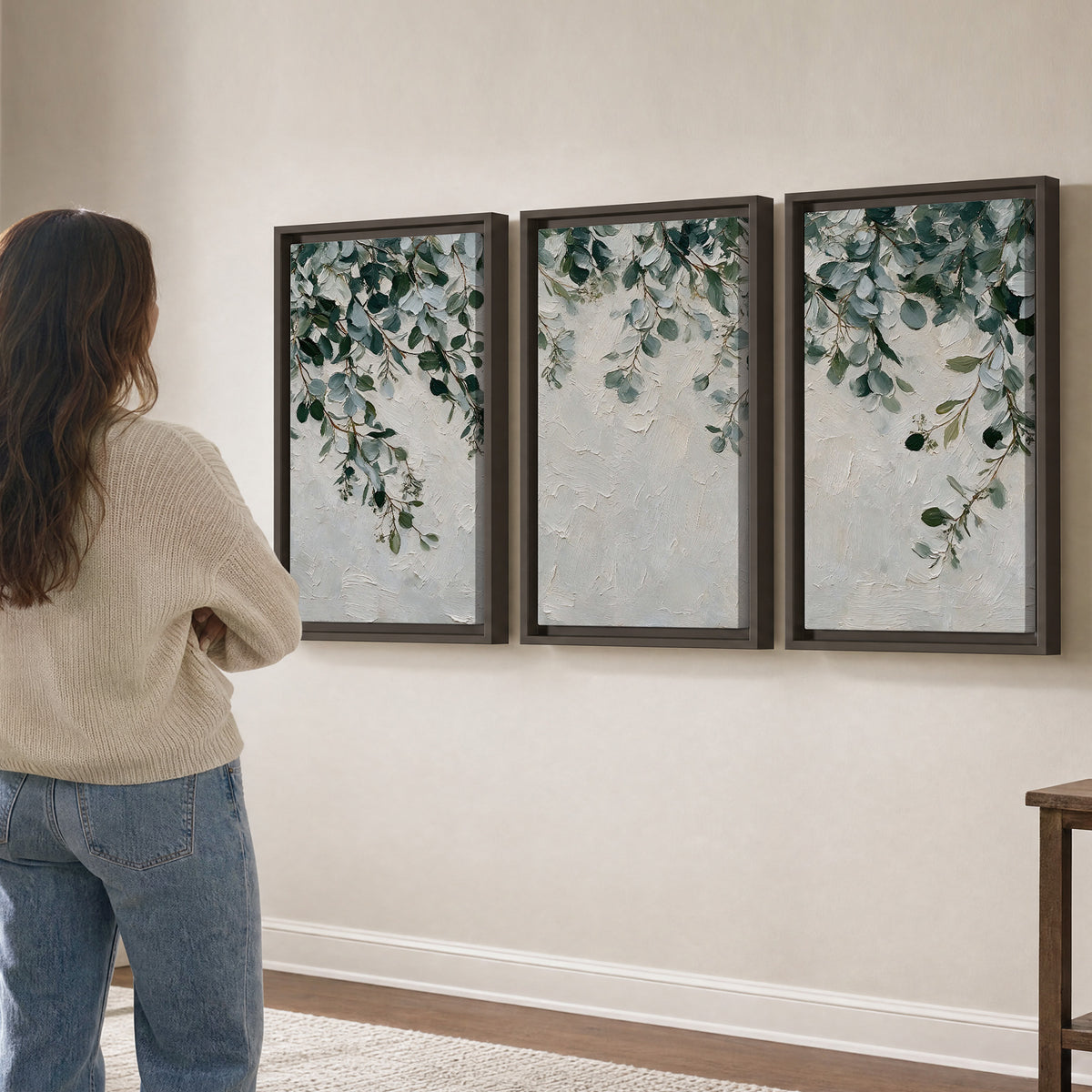 Soft green eucalyptus branches on a cream background 3 piece framed canvas wall art three panel arrangement on a wall