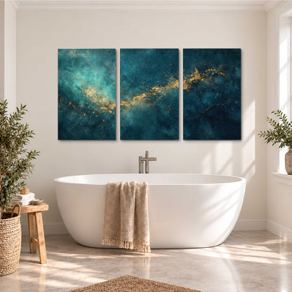 Deep teal clouds with sweeping gold-colored accents 3 piece canvas wall art styled in an interior