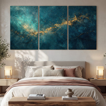 Deep teal clouds with sweeping gold-colored accents 3 piece canvas wall art displayed in a bedroom