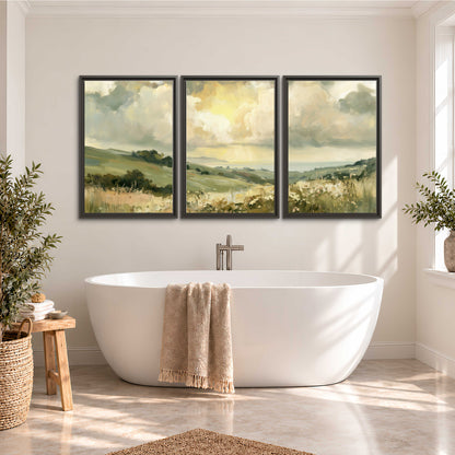 Rolling green hills beneath a luminous cloudy sky 3 piece framed canvas wall art styled in an interior