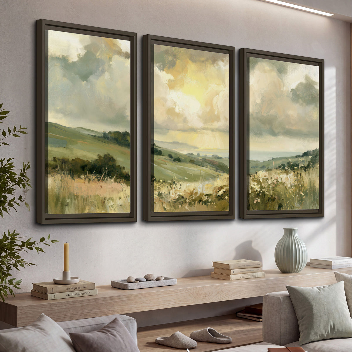 Rolling green hills beneath a luminous cloudy sky 3 piece framed canvas wall art displayed in a console