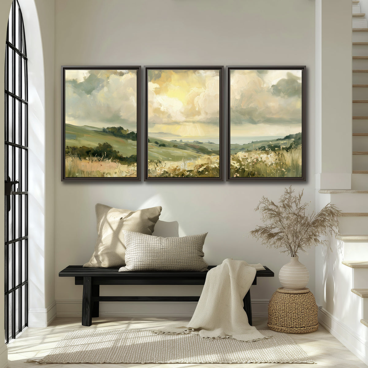 Rolling green hills beneath a luminous cloudy sky 3 piece framed canvas wall art displayed in a entryway