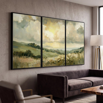 Rolling green hills beneath a luminous cloudy sky 3 piece framed canvas wall art displayed in a modern living room