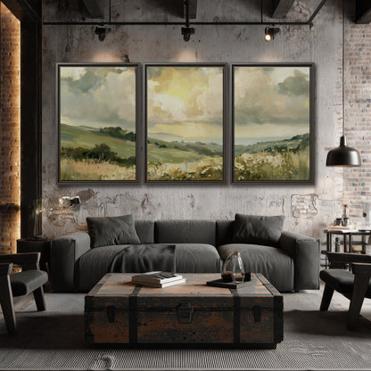 Rolling green hills beneath a luminous cloudy sky 3 piece framed canvas wall art displayed in a industrial room