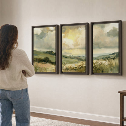 Rolling green hills beneath a luminous cloudy sky 3 piece framed canvas wall art three panel arrangement on a wall