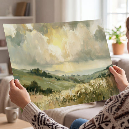 Rolling green hills beneath a luminous cloudy sky single poster print held in hands