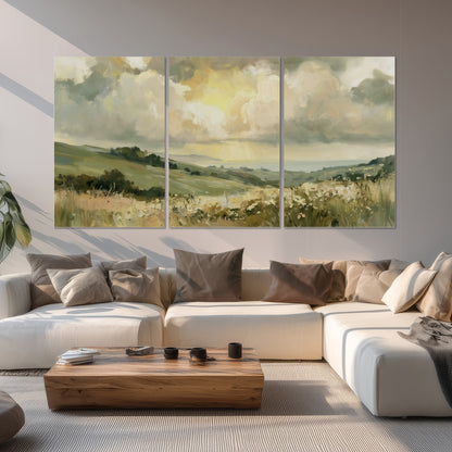 Rolling green hills beneath a luminous cloudy sky set of 3 poster prints displayed in a living room