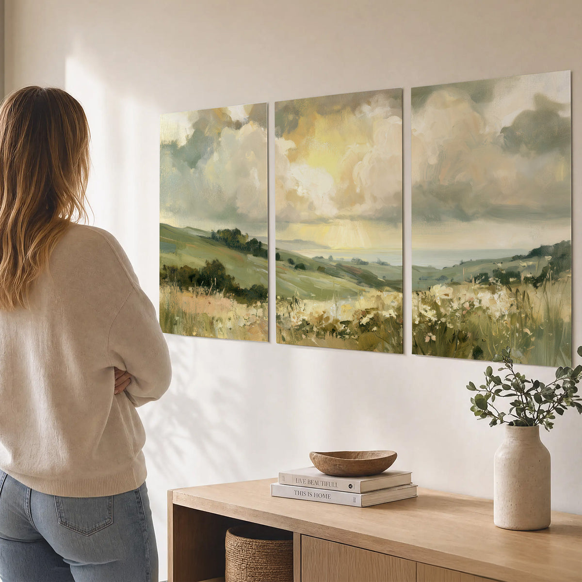 Rolling green hills beneath a luminous cloudy sky set of 3 poster prints three panel arrangement on a wall
