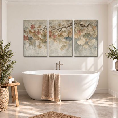 Cream and blush ginkgo leaves on delicate branches 3 piece canvas wall art styled in an interior