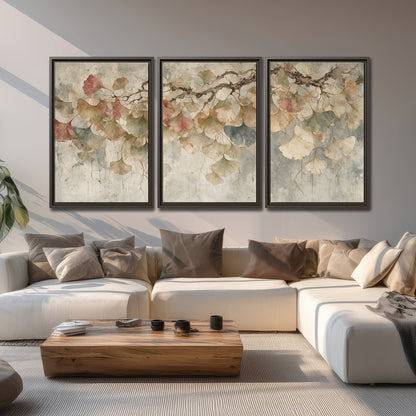 Cream and blush ginkgo leaves on delicate branches 3 piece framed canvas wall art displayed in a living room