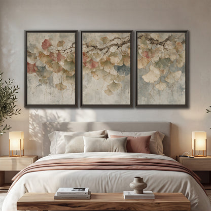 Cream and blush ginkgo leaves on delicate branches 3 piece framed canvas wall art displayed in a bedroom