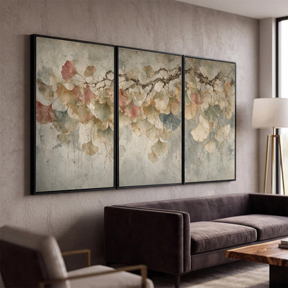 Cream and blush ginkgo leaves on delicate branches 3 piece framed canvas wall art displayed in a modern living room