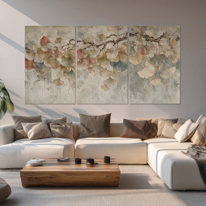 Cream and blush ginkgo leaves on delicate branches set of 3 poster prints displayed in a living room