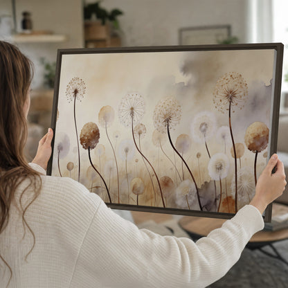 Delicate dandelion seed heads in warm misty light single framed canvas wall art held in hands