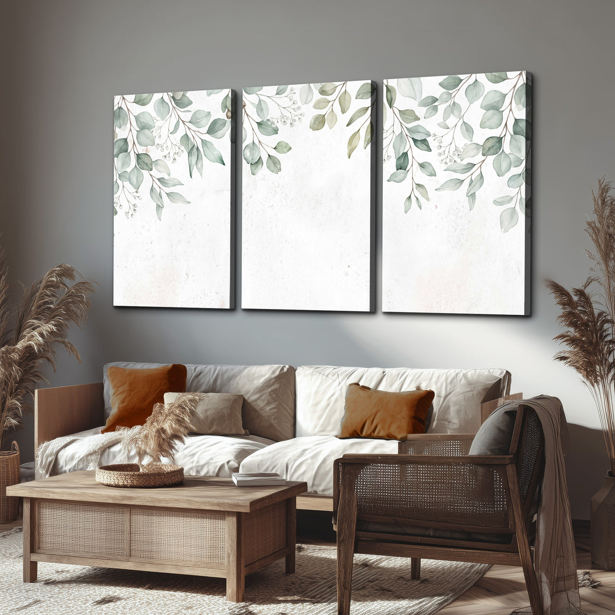 Pale sage eucalyptus leaves against a light background 3 piece canvas wall art displayed in a rustic living room