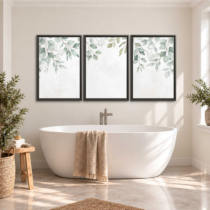 Pale sage eucalyptus leaves against a light background 3 piece framed canvas wall art styled in an interior