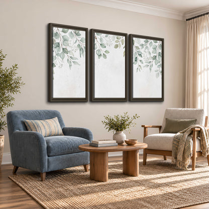 Pale sage eucalyptus leaves against a light background 3 piece framed canvas wall art styled in an interior