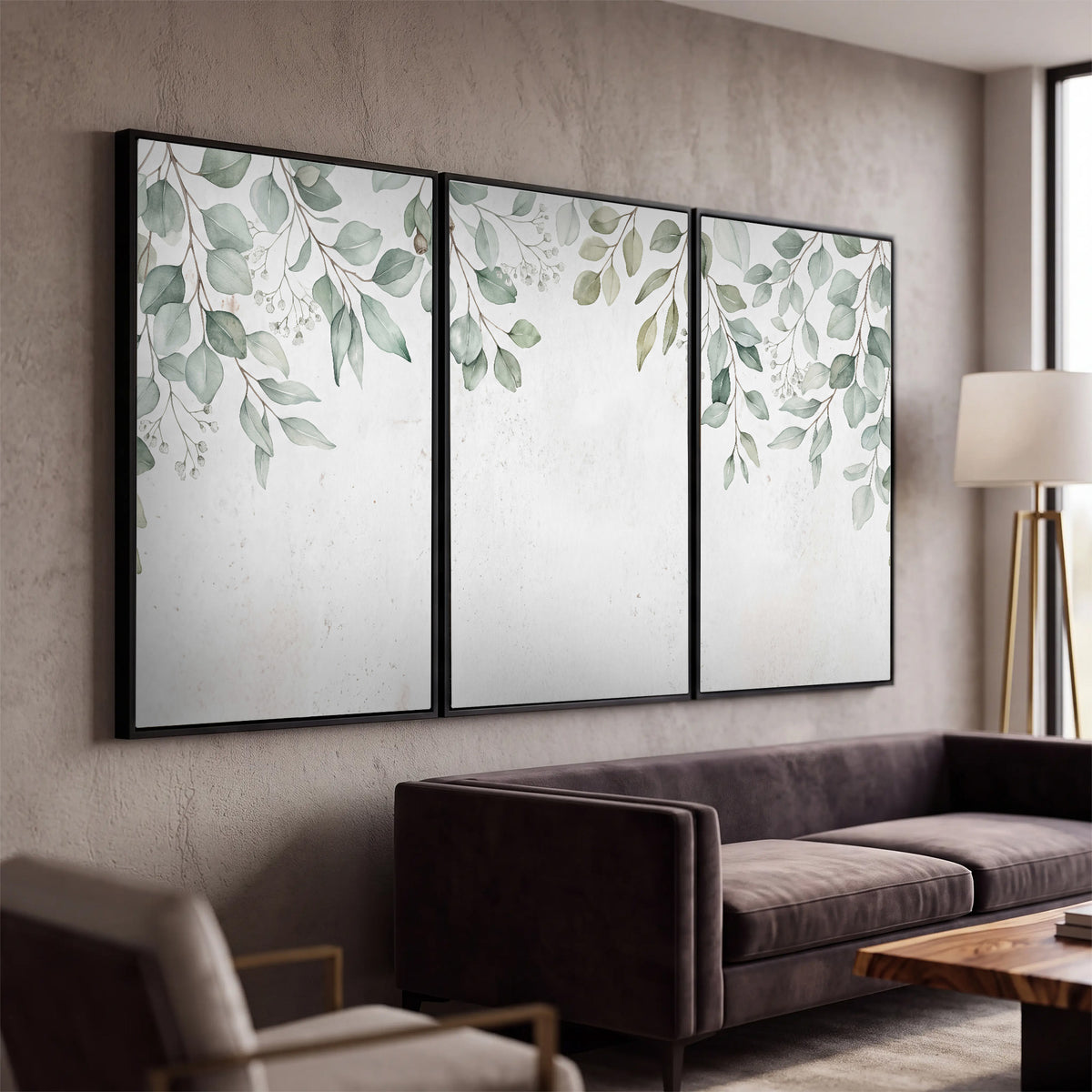 Pale sage eucalyptus leaves against a light background 3 piece framed canvas wall art displayed in a modern living room