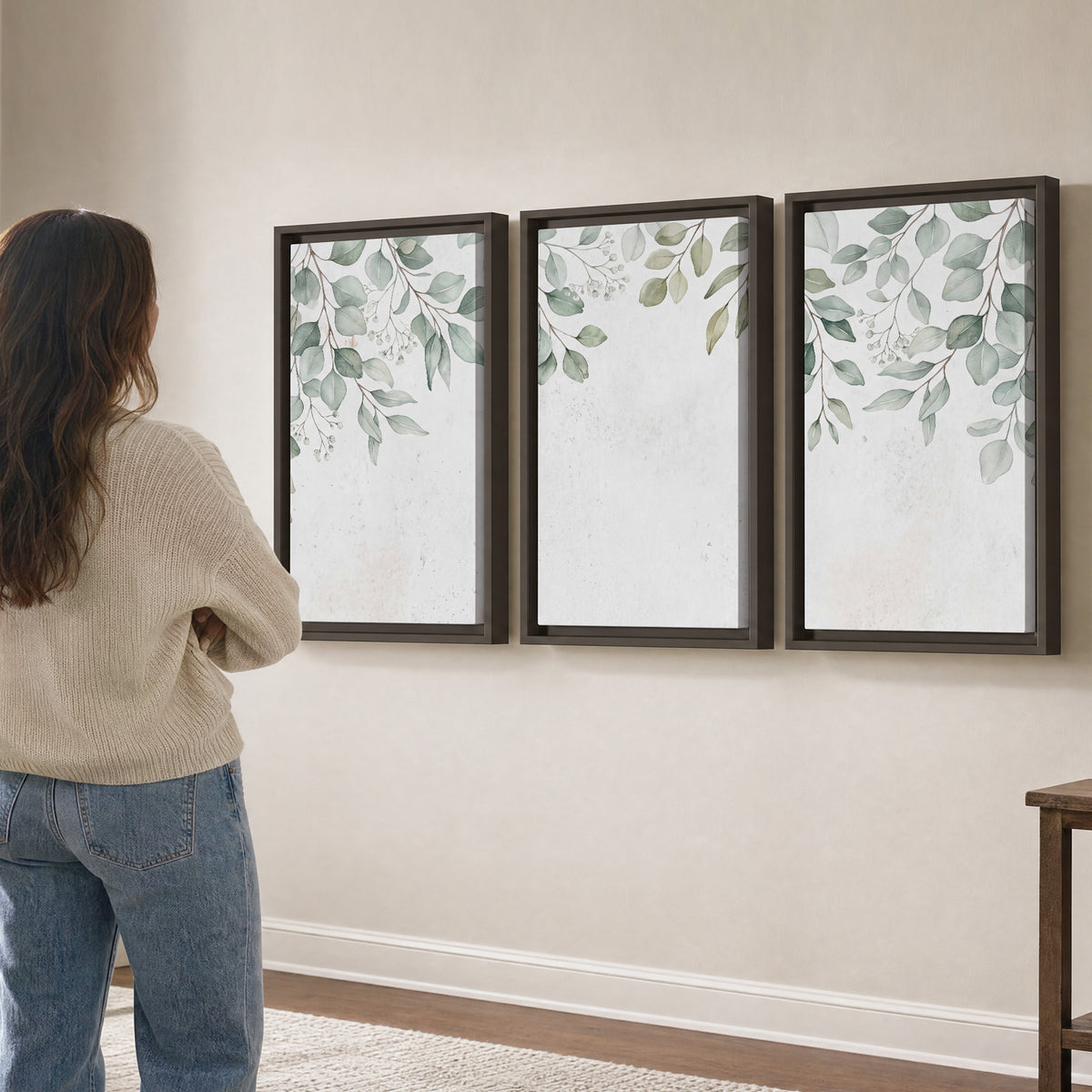 Pale sage eucalyptus leaves against a light background 3 piece framed canvas wall art three panel arrangement on a wall