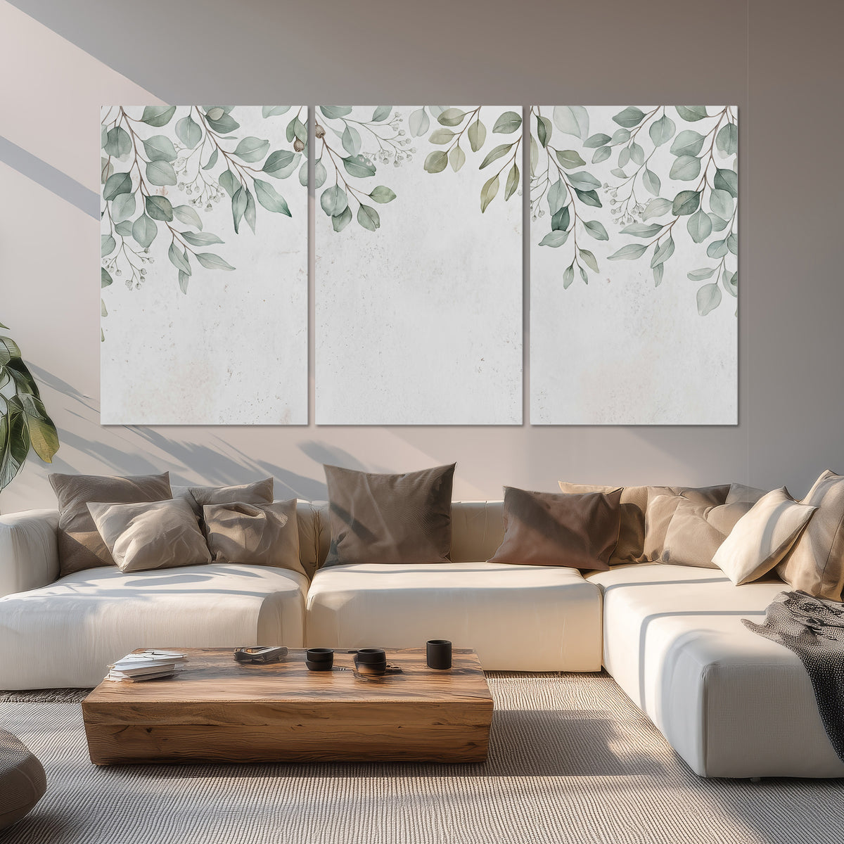Pale sage eucalyptus leaves against a light background set of 3 poster prints displayed in a living room