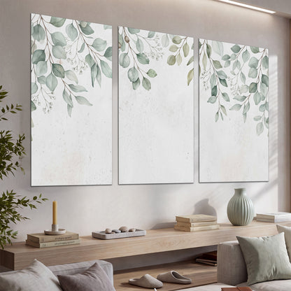 Pale sage eucalyptus leaves against a light background set of 3 poster prints displayed in a console