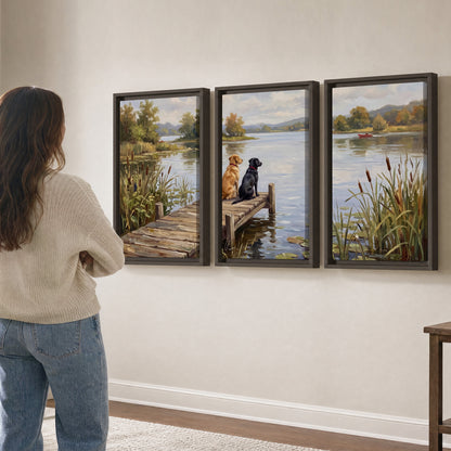 Two dogs sitting together on a wooden dock overlooking a peaceful lake 3 piece framed canvas wall art three panel arrangement on a wall