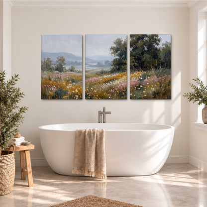 A flower-filled meadow overlooking soft blue mountain ridges 3 piece canvas wall art styled in an interior