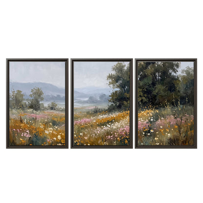 A flower-filled meadow overlooking soft blue mountain ridges 3 piece framed canvas wall art viewed straight on