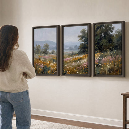 A flower-filled meadow overlooking soft blue mountain ridges 3 piece framed canvas wall art three panel arrangement on a wall