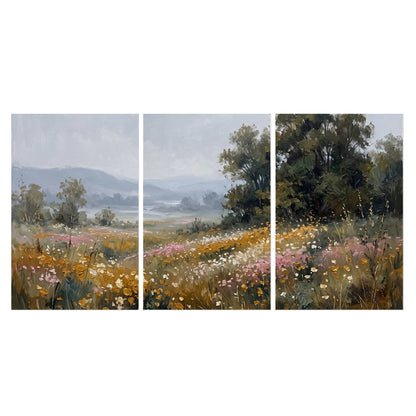 A flower-filled meadow overlooking soft blue mountain ridges set of 3 poster prints viewed straight on
