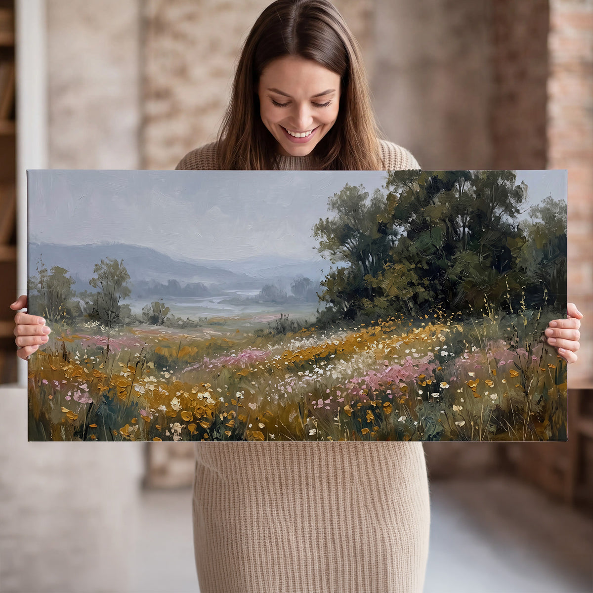 A flower-filled meadow overlooking soft blue mountain ridges single canvas wall art held in hands