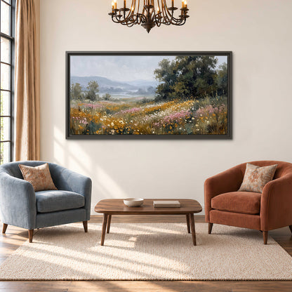 A flower-filled meadow overlooking soft blue mountain ridges single framed canvas wall art styled in an interior