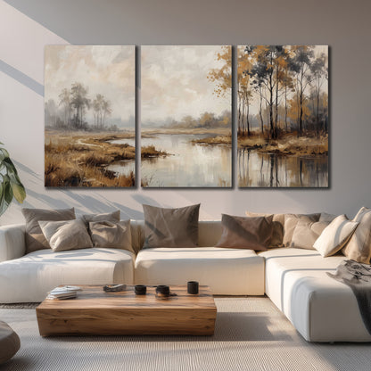 Warm autumn trees beside a quiet reflective river 3 piece canvas wall art displayed in a living room