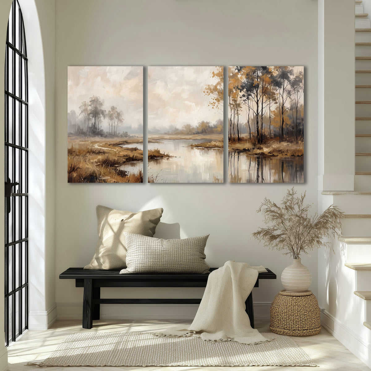Warm autumn trees beside a quiet reflective river 3 piece canvas wall art displayed in a entryway