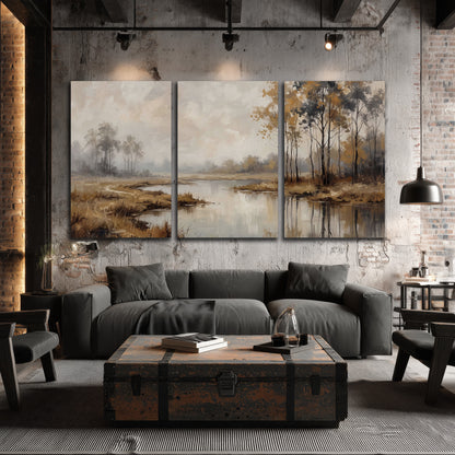 Warm autumn trees beside a quiet reflective river 3 piece canvas wall art displayed in a industrial room