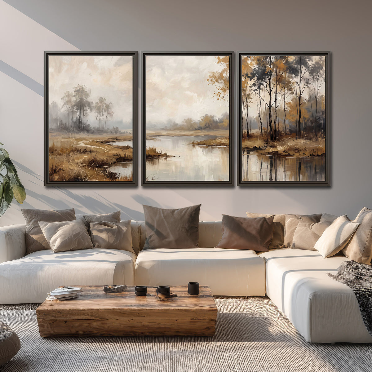 Warm autumn trees beside a quiet reflective river 3 piece framed canvas wall art displayed in a living room