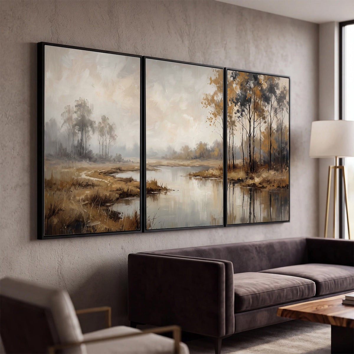 Warm autumn trees beside a quiet reflective river 3 piece framed canvas wall art displayed in a modern living room
