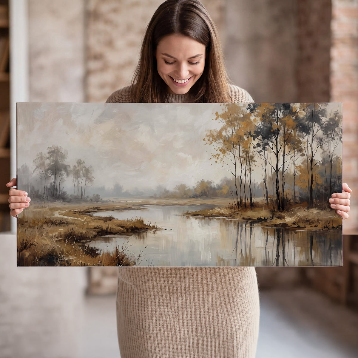 Warm autumn trees beside a quiet reflective river single canvas wall art held in hands