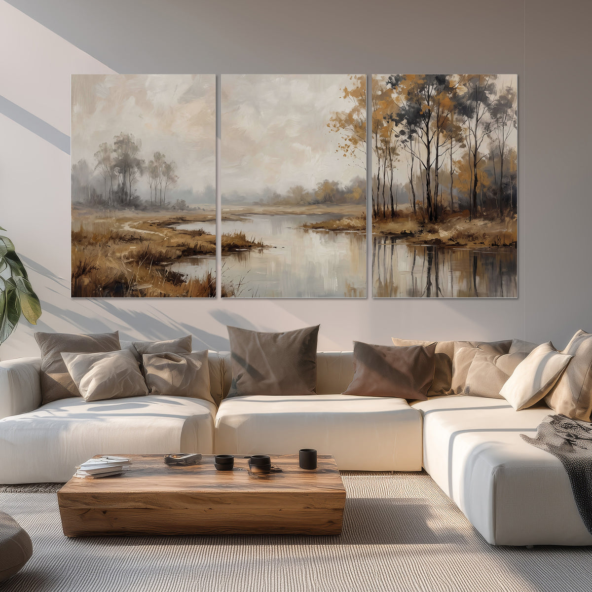 Warm autumn trees beside a quiet reflective river set of 3 poster prints displayed in a living room
