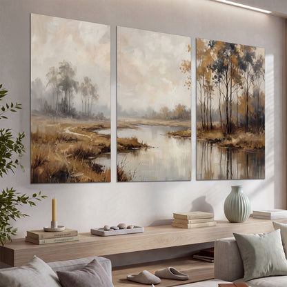 Warm autumn trees beside a quiet reflective river set of 3 poster prints displayed in a console